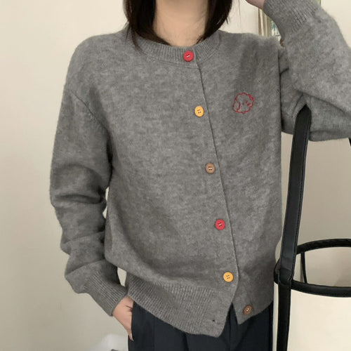 Ladies cozy knitted pullover with buttoned neckline and embroidered pattern Amarae