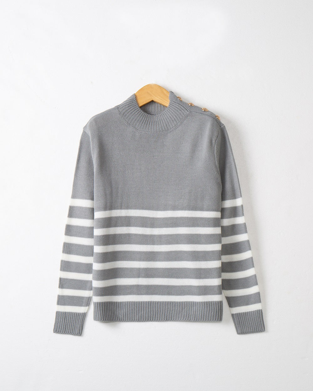 Fashionable knitted sweater for women with striped pattern and button details Lune London
