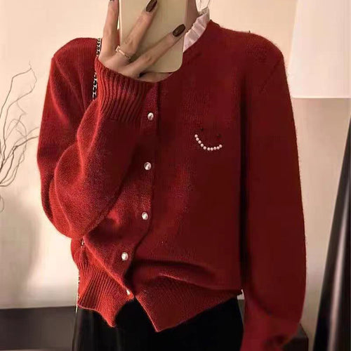 Women’s knitted jacket with decorative buttons and festive design Amarae