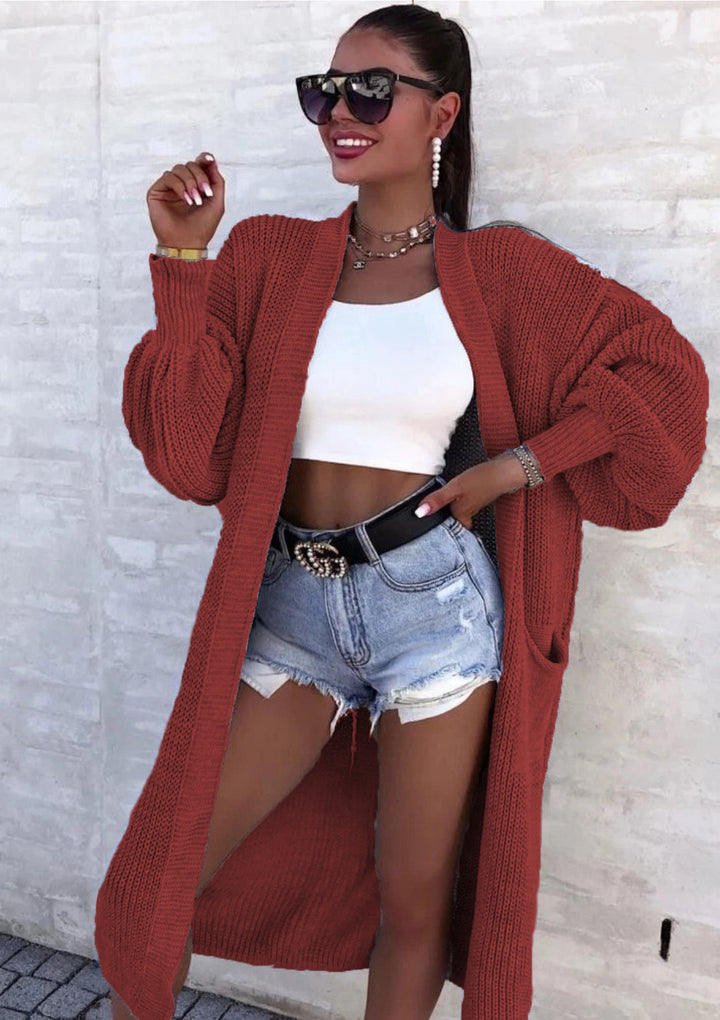 Long knitted coat for women with oversized sleeves and practical pockets Lune London