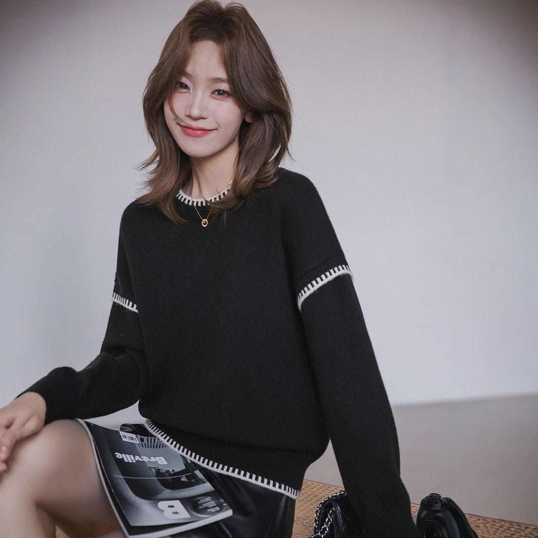 Pull confortable pour femme avec ourlet texturé et accents modernes Chic & Stil