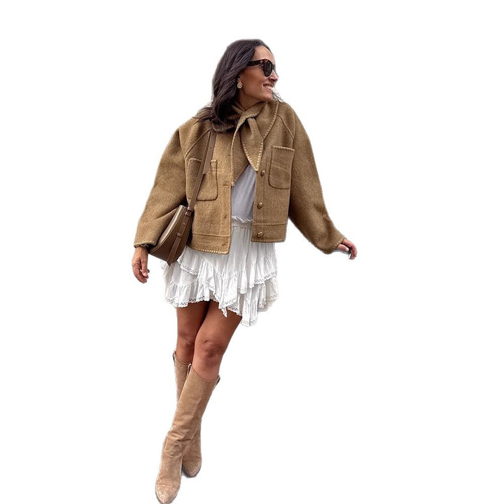 Women's short jacket made of wool blend with a suggested shawl collar, decorative seams, and boxy cropped cut Amarae