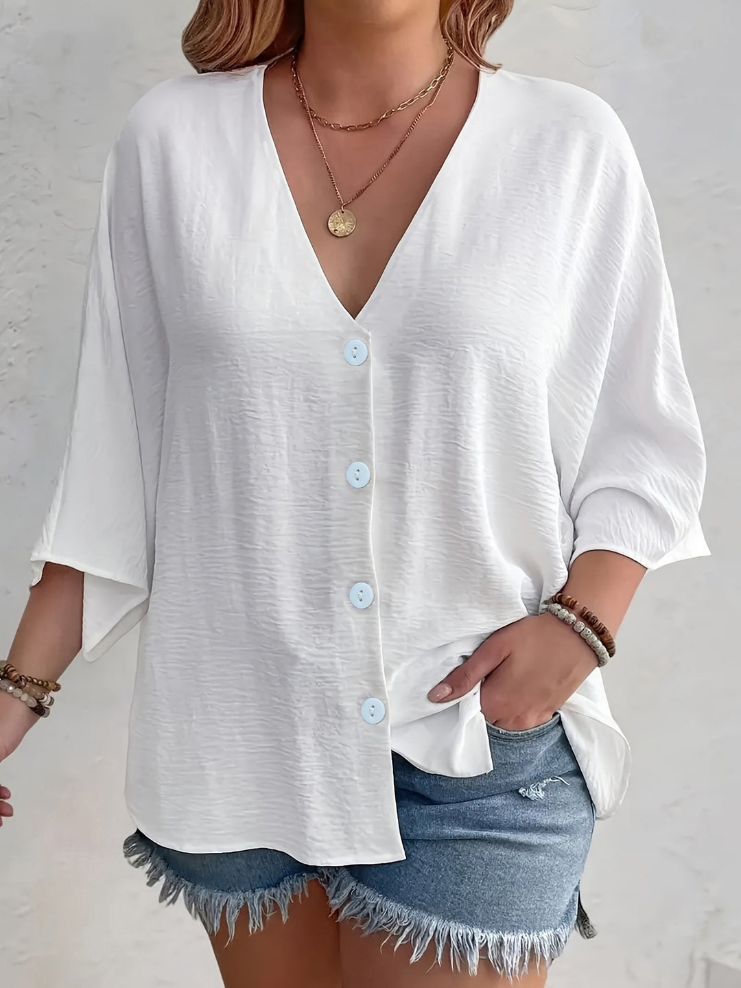Short-sleeved advantageous blouse for ladies with button placket and V neckline Lune London