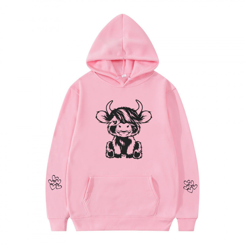 Women's hooded sweatshirt with charming cow motif and practical kangaroo pockets Lune London