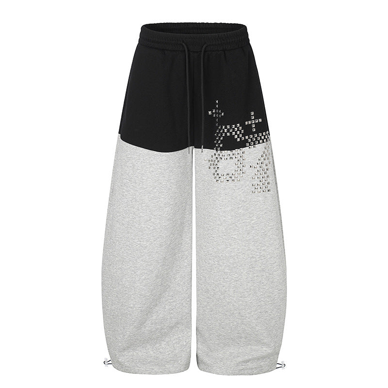 Women's Oversize Two-Tone Palazzo Sweatpants made of French Terry with logo studs, drawstring and adjustable hem.
