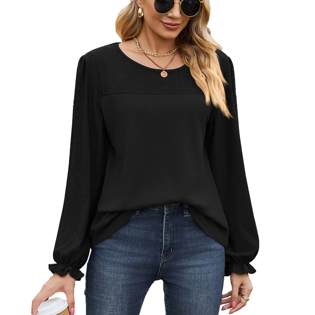 Women's top with textured design and elegant puff sleeves Amarae