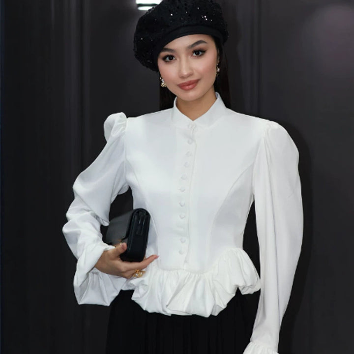 Ladies tailored peplum blouse with stand-up collar, covered button placket and puff sleeves Amarae