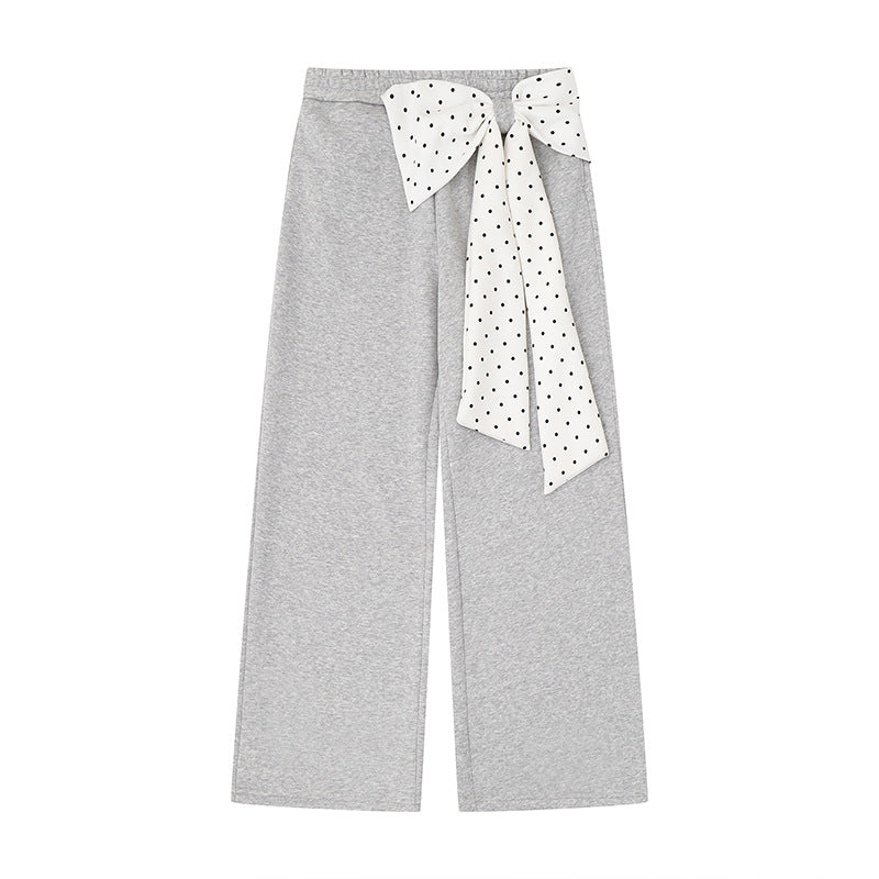 Women's culotte joggers with wide legs and decorative polka dot bow detail