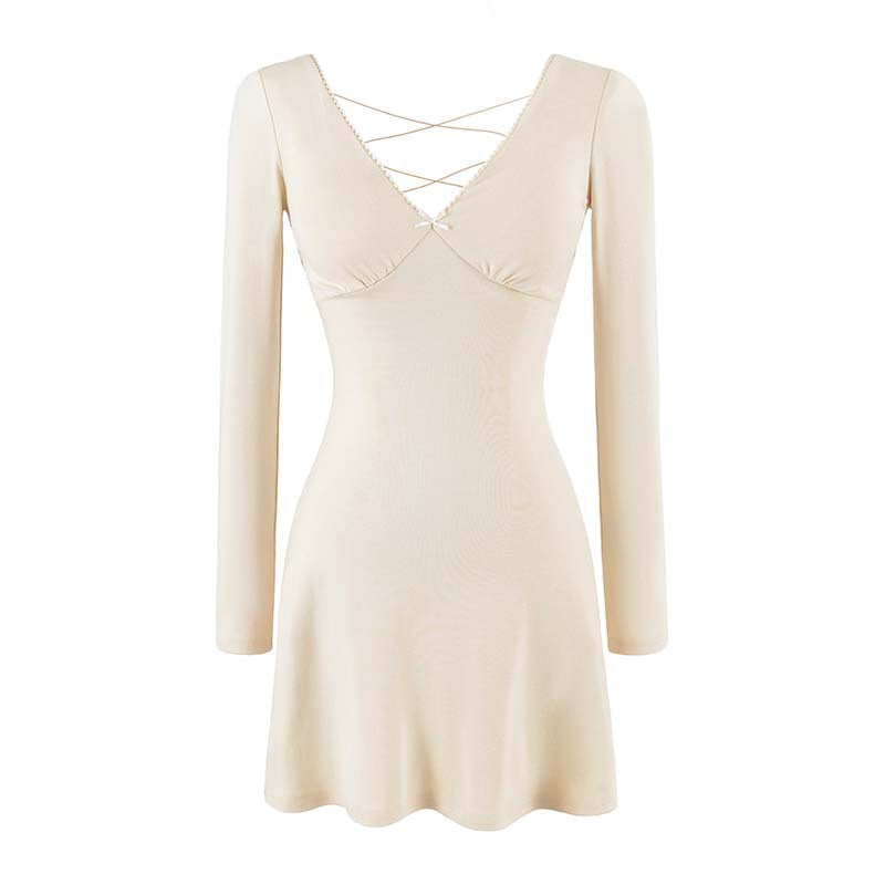 Ladies form-fitting mini dress with a deep V-neckline, gathered bust, and crossed back straps Amarae