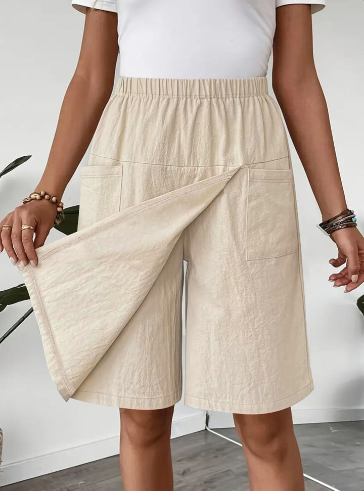 Mid-length wrap skirt for women with elastic waist and practical pockets Lune London