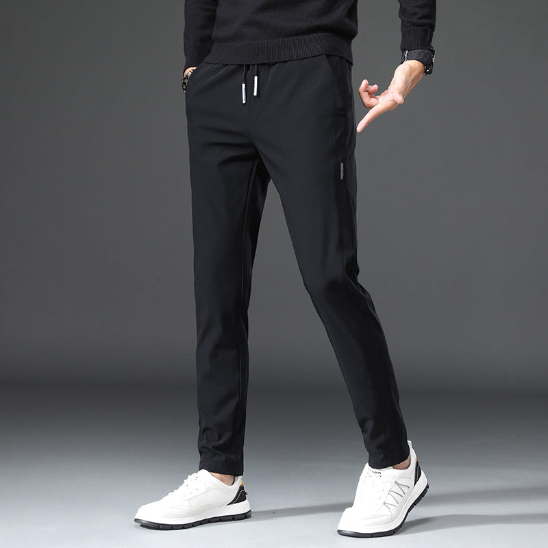 Men's slim fit sports pants with elastic waistband and practical zip pockets Lune London