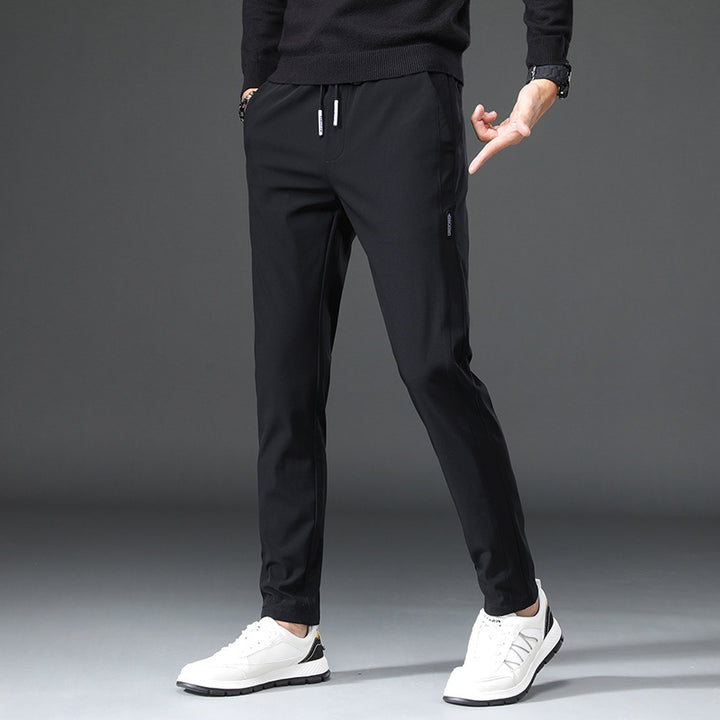 Men's slim fit sports pants with elastic waistband and practical zip pockets Lune London