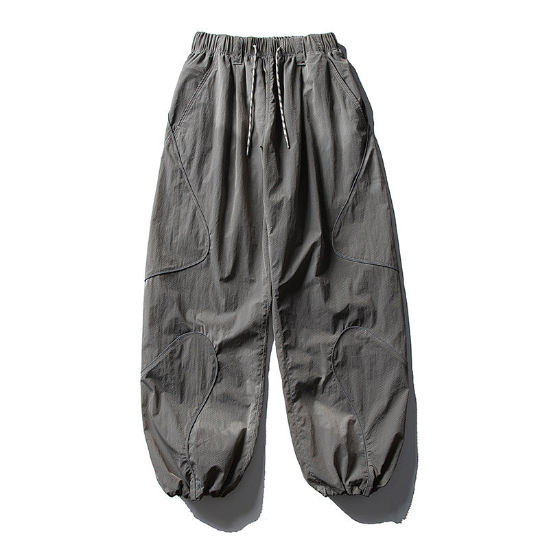 Men's loose utility harem pants made of ripstop with drawstring waistband, shaped panels, and elastic ankle cuffs Amarae