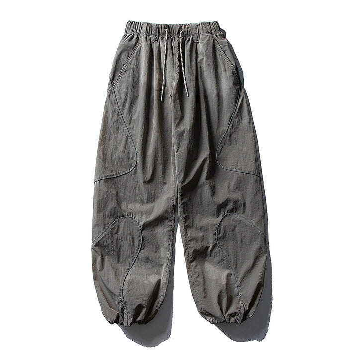 Men's loose utility harem pants made of ripstop with drawstring waistband, shaped panels, and elastic ankle cuffs Amarae