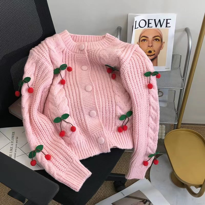 Women's knit jacket with playful cherry pattern and elegant braid patterns Lune London