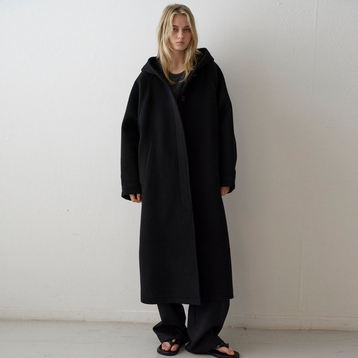 Manteau en laine surdimensionné pour femmes avec capuche et poches pratiques Chic & Stil