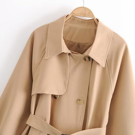 Women Short Tailored Trench Coat with Tied Belt, Asymmetrical Storm Flap and Cuff Strap Amarae