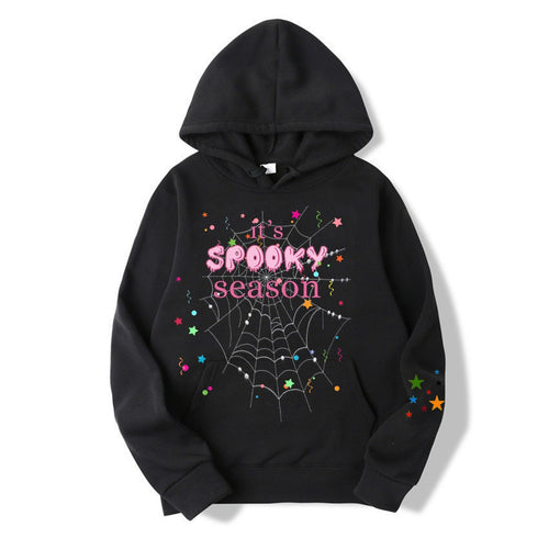 Women cozy hoodie with graphic Halloween design Chic & Stil