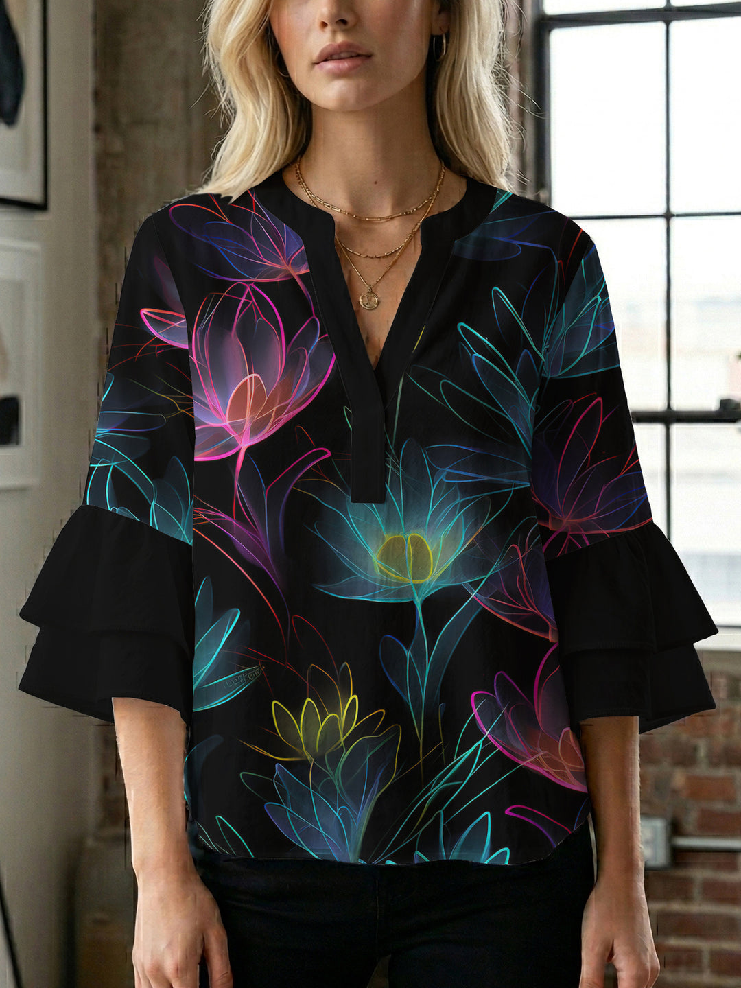 Women’s blouse with voluminous ruffled sleeves and floral pattern Lune London