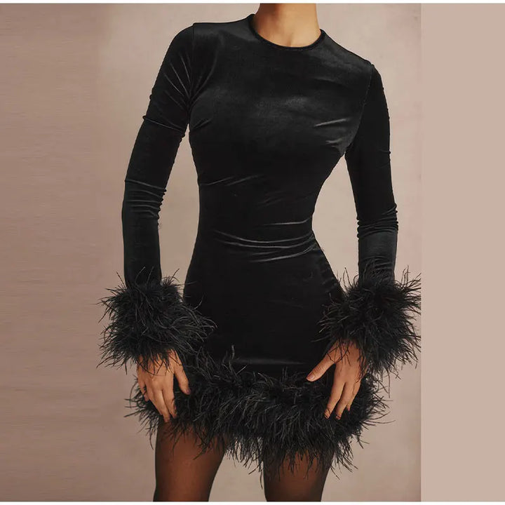 Lune London | Elegant fitted dress with feather embellishments on the sleeves