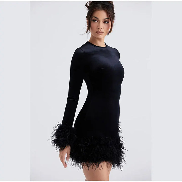 Lune London | Elegant fitted dress with feather embellishments on the sleeves