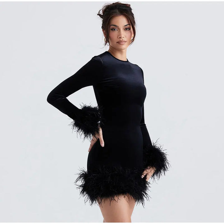 Lune London | Elegant fitted dress with feather embellishments on the sleeves