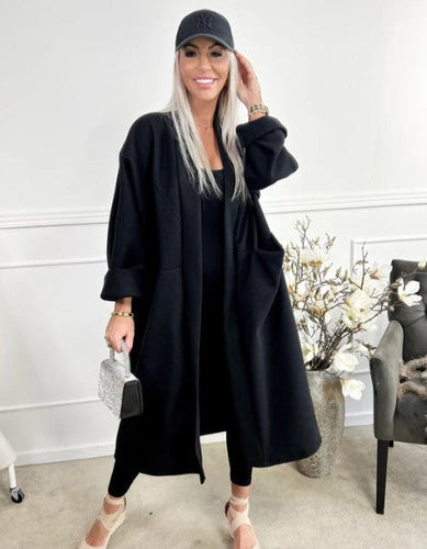 Amarae | oversized coat with seams and transparent pockets