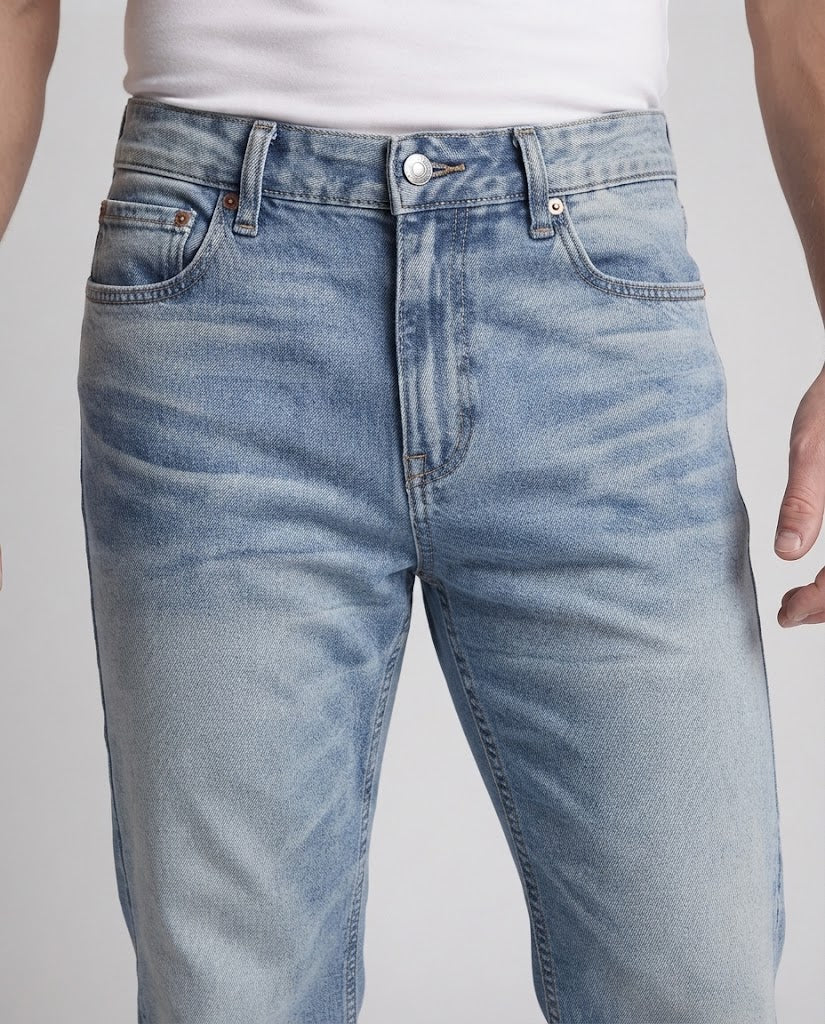 Men's loose-fitting stonewashed denim jeans with floor-length hem and distinctive pleats Amarae