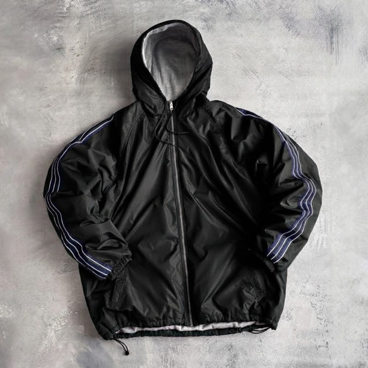 Veste de coupe-vent pour femmes avec capuche doublée et poches latérales Chic & Stil